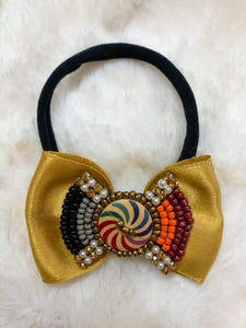 Gold Candy Spin Bow Headband